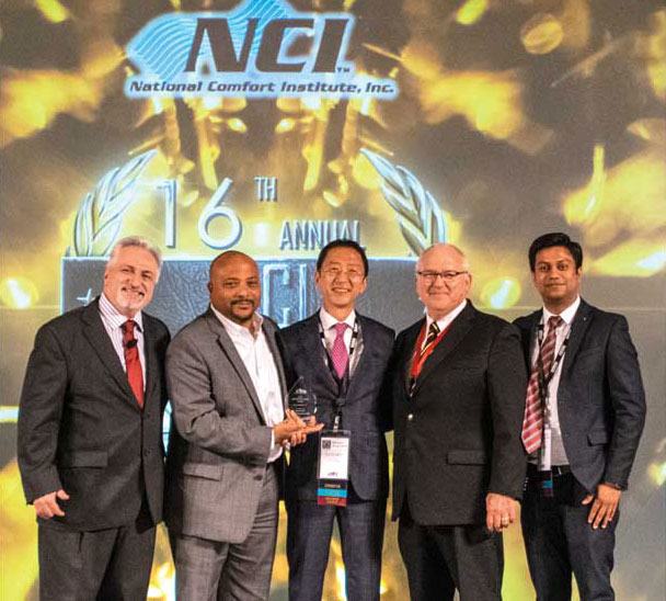 NCI awarded Goodman its Preferred Partners Award. Saturo Akama, (center) president of Goodman, accepted the award. - The ACHR News