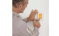 Here, a contractor installs Resideo’s Honeywell Home T10 Pro Smart Thermostat. - The ACHR News