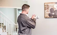 Emerson Contractor Smart Thermostat Emerson contractor installing a smart thermostat.