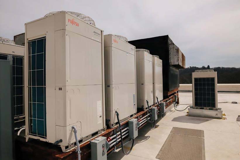 Several Fujitsu Airstage systems are installed on the rooftop of a mixed-use office building in Tarrytown, New York.