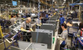 Goodman employees work to manufacture highend equipment.