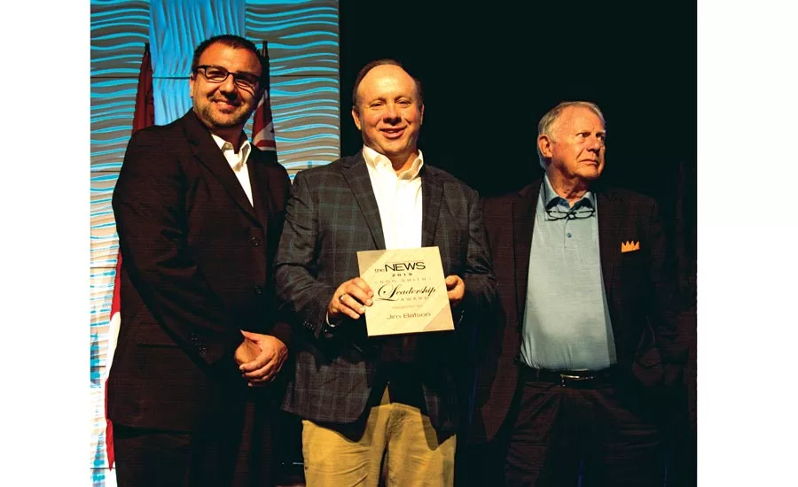 ACHR NEWS editorial director Kyle Gargaro (at left) and Ron Smith (at right) present The ACHR NEWS’ Ron Smith Leadership Award to Jim Batson, owner and CEO of H.C. Blake Co.
