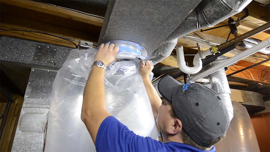 The Aeroseal contractor connects the layflat tubing to the ductwork.