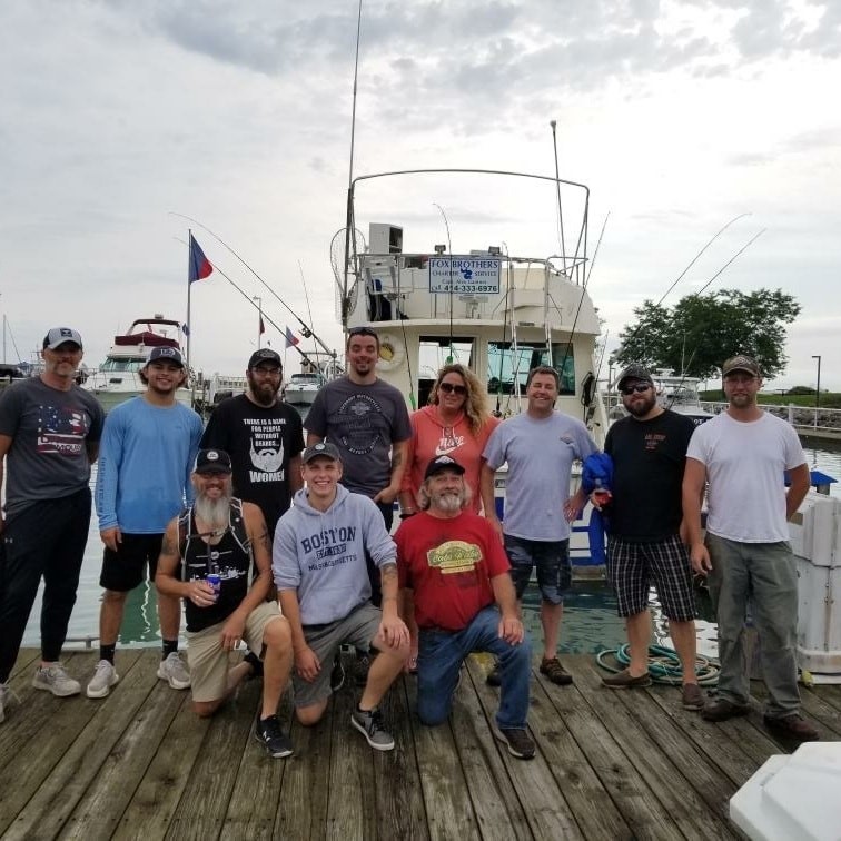 The crew at Professional Services enjoys a day of fishing on Lake Michigan.
