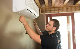 A Restivo’s technician installs a ductless unit for a client.