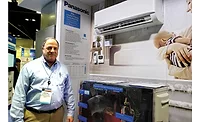 Panasonic-ClimaPure-XE-Series-Ductless-Heat-Pump-System.jpg Victor Flynn stands next to the ClimaPure XE Series ductless heat pump system.