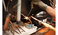 Replacing a compressor in an R-290 system.