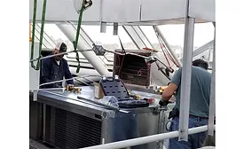 Workers install new equipment at the Tennessee Aquarium in Chattanooga.