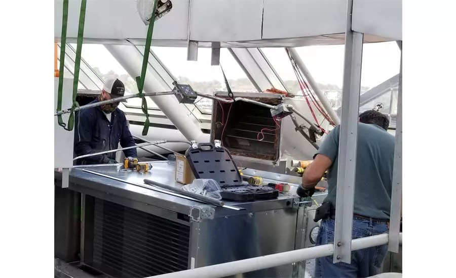 Workers install new equipment at the Tennessee Aquarium in Chattanooga.