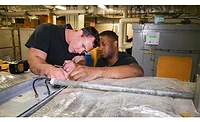 HVAC-Maintenance.jpg Here, technicians re-install an outside air duct filter during a preventative maintenance inspection on an HVAC system.