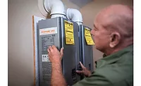 Propane-Tankless-Installation.jpg A technician installs a propane-fueled tankless water heater.