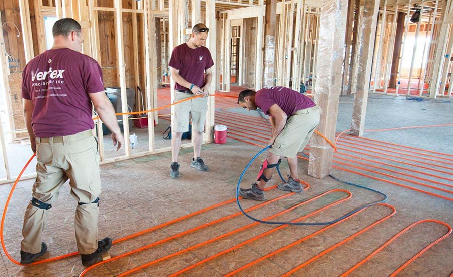 A crew from Vertex Mechanical Inc. in Pennsylvania installs a hydronic system in a new construction.