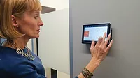 A customer interfaces with 75F’s Central Control Unit.