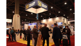 AHR attendees gather at the Yellow Jacket booth.