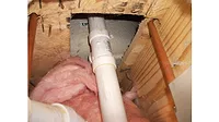 A hole under a tub.