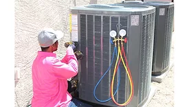 Technician servicing HVAC units.