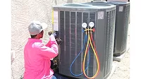 Technician servicing HVAC units.