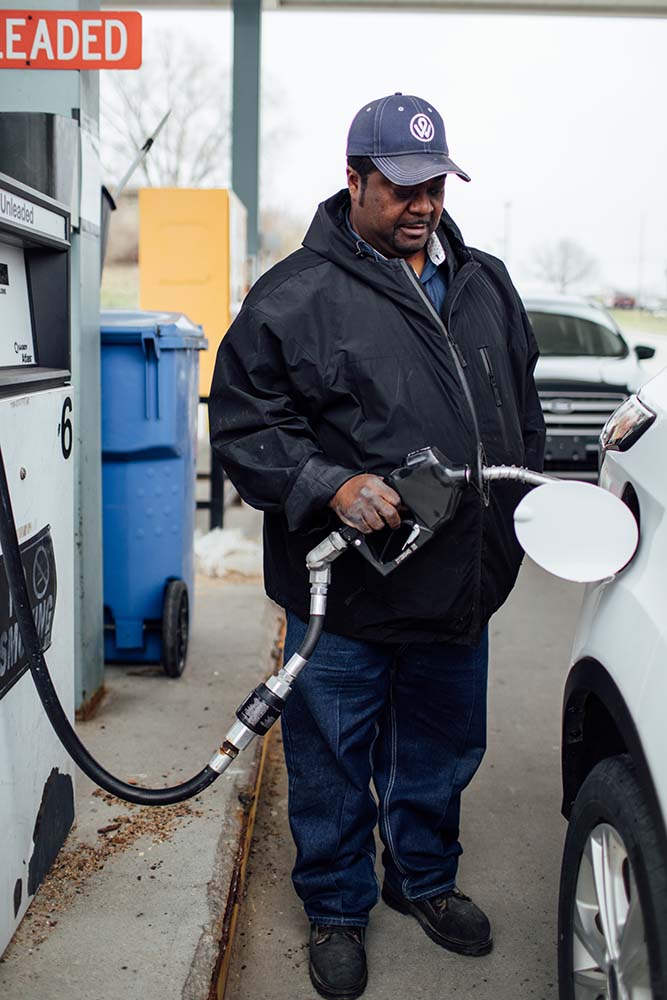 Fueling a car.