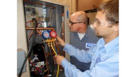 Technicians Servicing Refrigeration Equipment