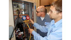 Technicians Servicing Refrigeration Equipment