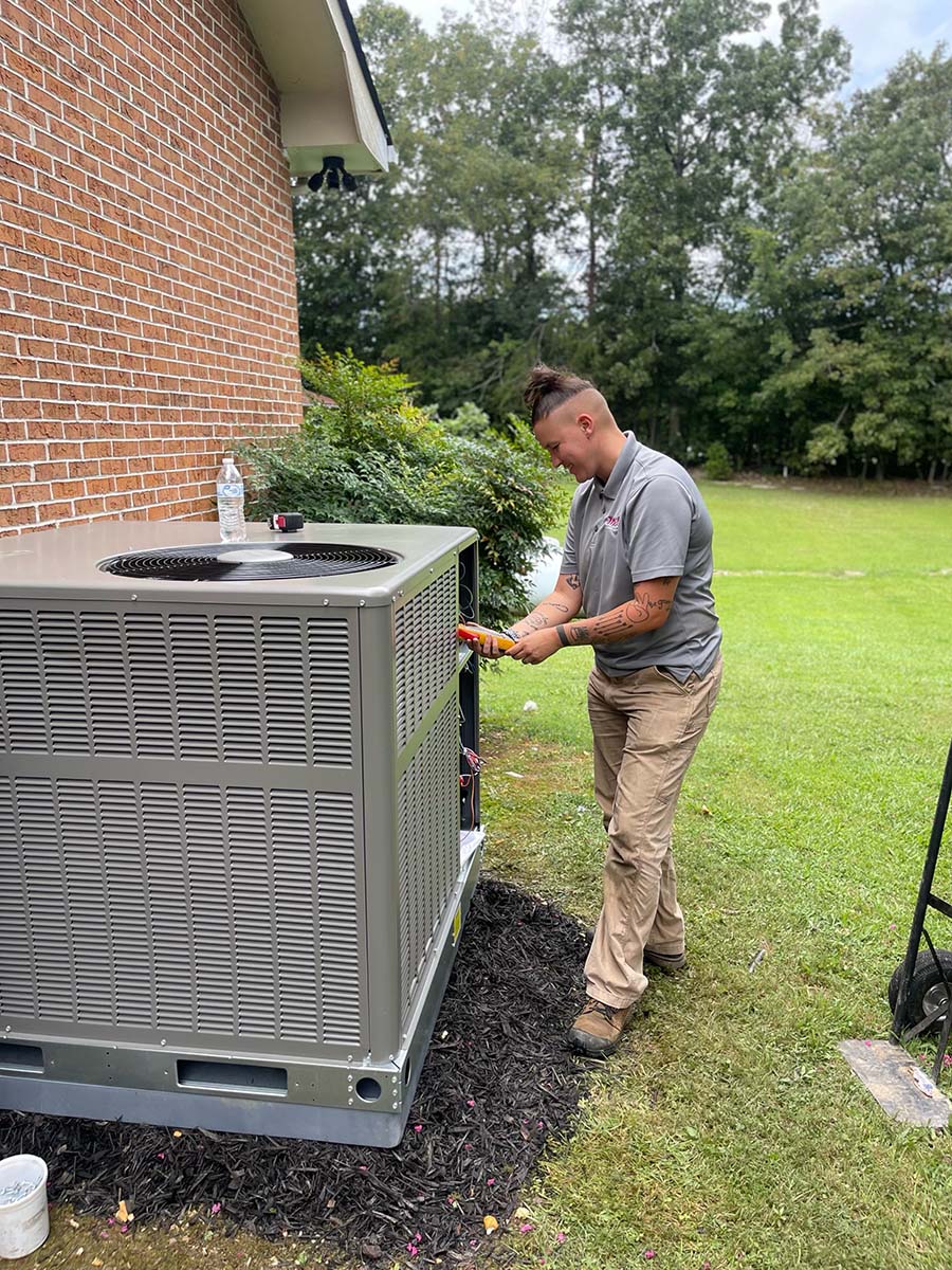 Technician servicing HVAC.