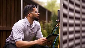 Technician Reading a Gauge