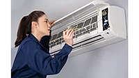Woman and HVAC Unit Woman and HVAC Unit