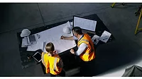 Contractor looking at design sheets Contractor looking at design sheets