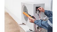 technician working on heat pump.jpg technician-working-on-heat-pump.jpg