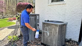 technician-cleaning-ac.jpg