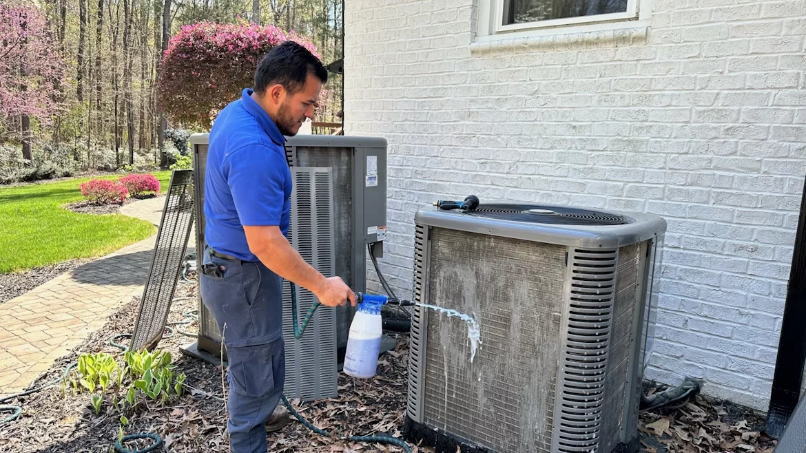 technician-cleaning-ac.jpg