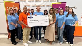 Carrier check presentation to Feeding America