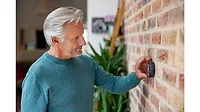 man using smart thermostat.jpg man-using-smart-thermostat.jpg