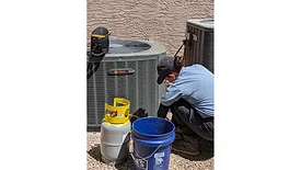 Contractor-replacing-compressor.jpg