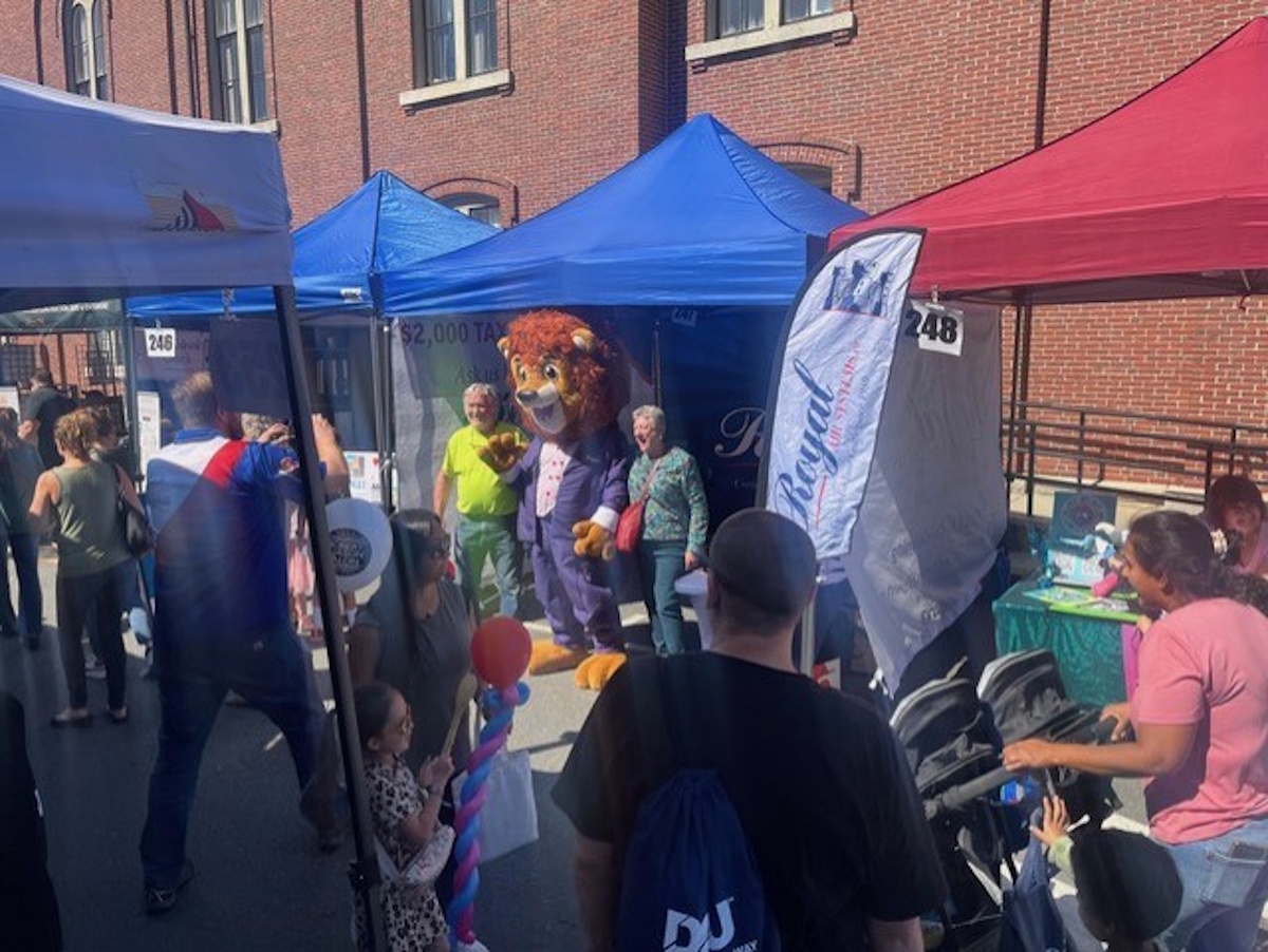 Reggie the royal lion at community event