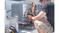 HVAC technician working.jpeg HVAC-technician-working.jpeg