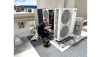 technician working on heat pump technician working on heat pump