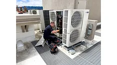 technician working on heat pump