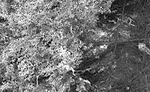 Figure 8. Particle cake formation on the surface of fibrous filter media. 