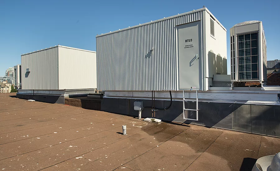 To heat and cool the historic building, custom-fabricated air handlers with high-static fan coils were connected to existing duct-work.