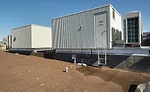 To heat and cool the historic building, custom-fabricated air handlers with high-static fan coils were connected to existing duct-work.