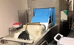 Dishwasher strip curtain being pushed open during operation