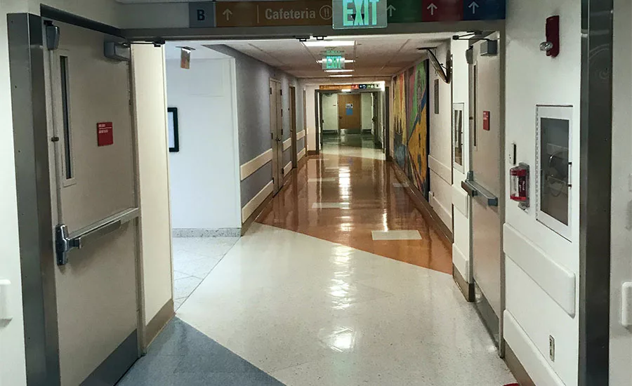 Fire doors on hold open serving as a horizontal exit and smoke barrier