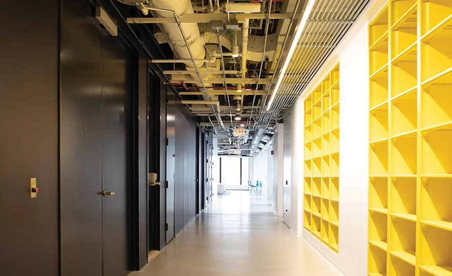 An open ceiling and shelving for a materials library