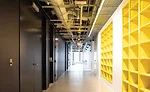 An open ceiling and shelving for a materials library