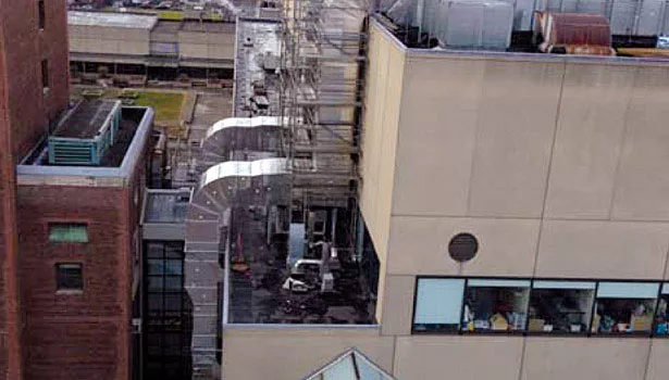 Exterior return air duct risers.