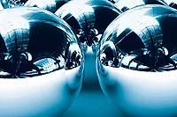 Lentz feature magnetic bearings, silver globes