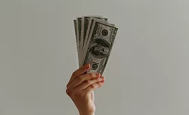person waving money