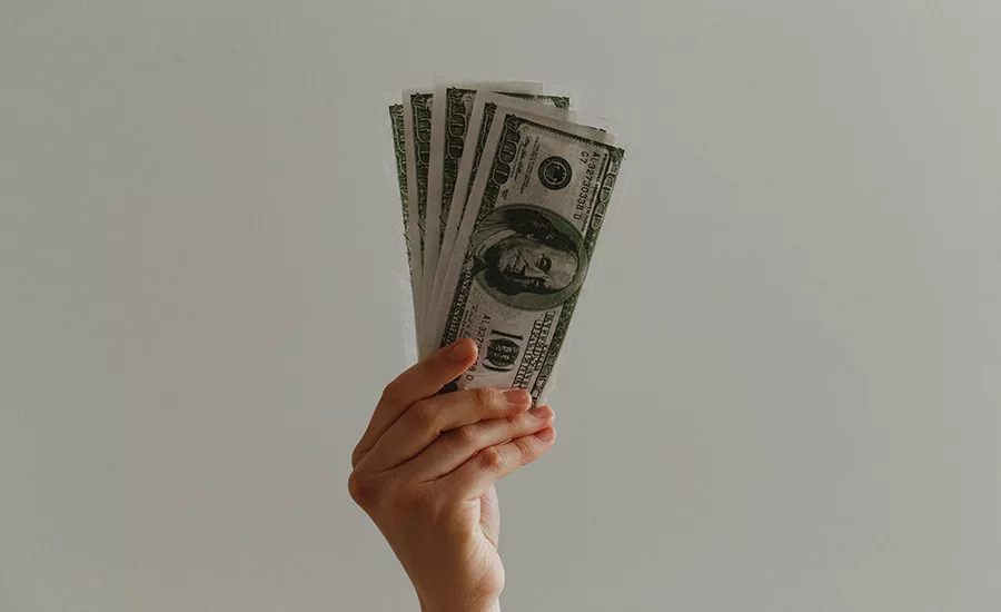 person waving money
