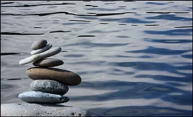 rocks stacked by a lake